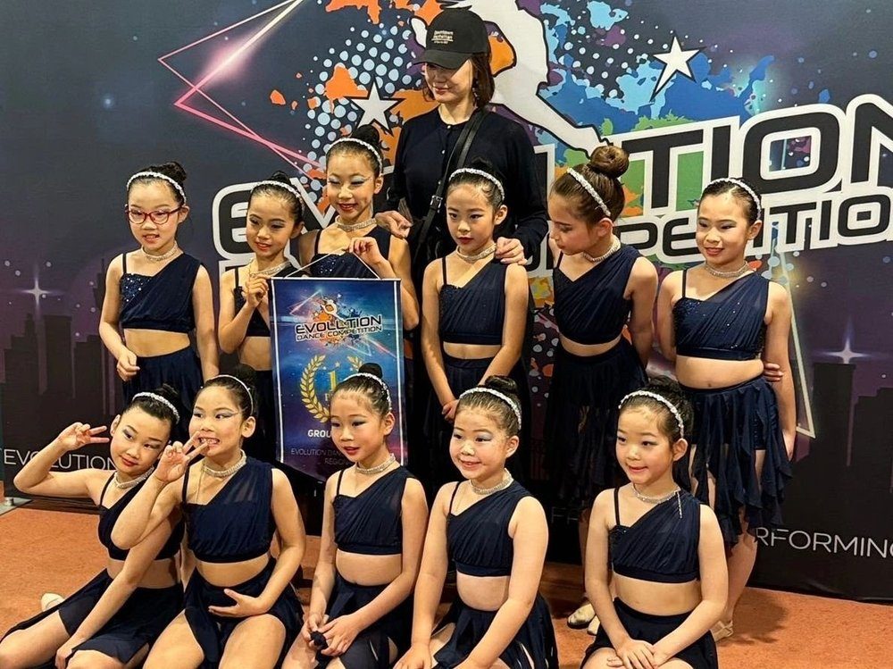 Competition team posing with a trophy